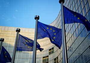 Eu flags in front of european commission building in brussels